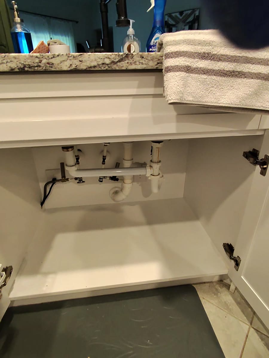 Kitchen sink cabinet before the new equipment was installed